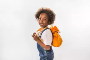young kenyan student carrying yellow bag on her back 300x200 - Back to School Promotional Products Kenya